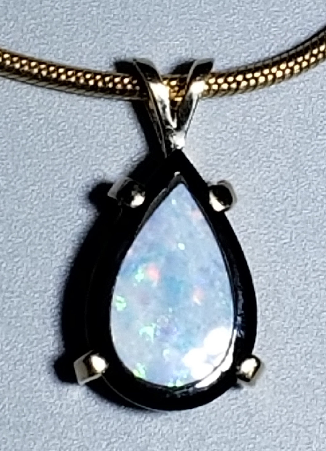 Opal and Onyx 14K yellow gold pendant